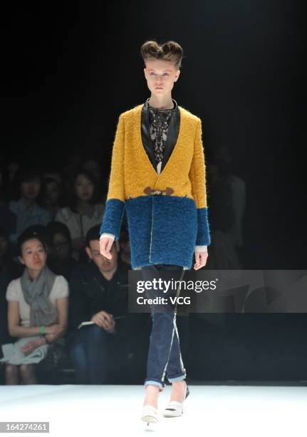 Model showcases designs on the runway at the Motonsri Ono show during Mercedes Benz Fashion Week Tokyo Autumn/Winter 2013/14 at Shibuya Hikarie...