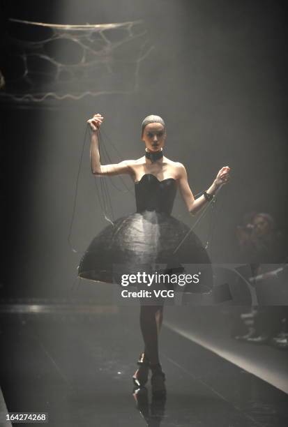 Model showcases designs on the runway at the Alice Auaa show during Mercedes Benz Fashion Week Tokyo Autumn/Winter 2013/14 at Shibuya Hikarie Hikari...