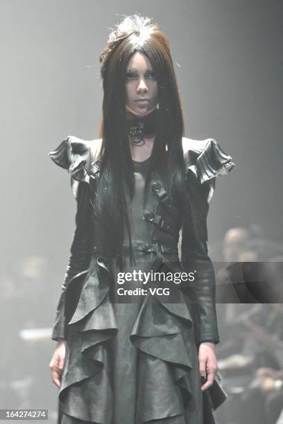 Model showcases designs on the runway at the Alice Auaa show during Mercedes Benz Fashion Week Tokyo Autumn/Winter 2013/14 at Shibuya Hikarie Hikari...