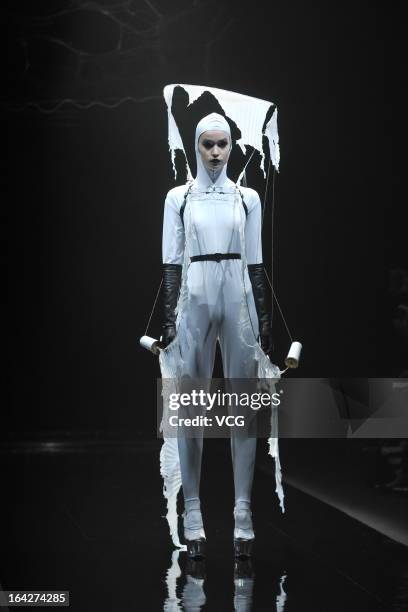 Model showcases designs on the runway at the Alice Auaa show during Mercedes Benz Fashion Week Tokyo Autumn/Winter 2013/14 at Shibuya Hikarie Hikari...