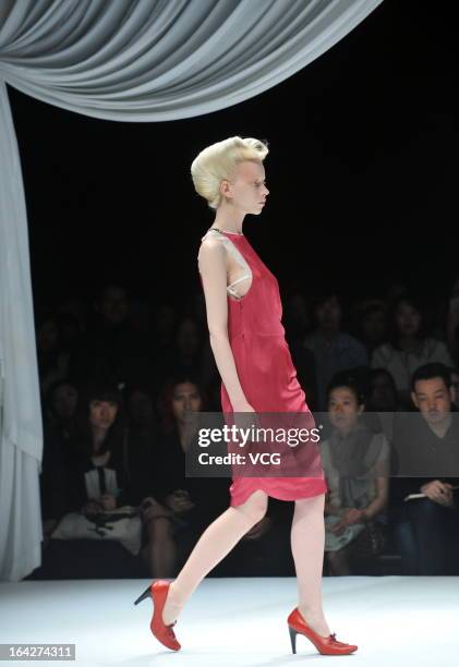 Model showcases designs on the runway at the Motonsri Ono show during Mercedes Benz Fashion Week Tokyo Autumn/Winter 2013/14 at Shibuya Hikarie...