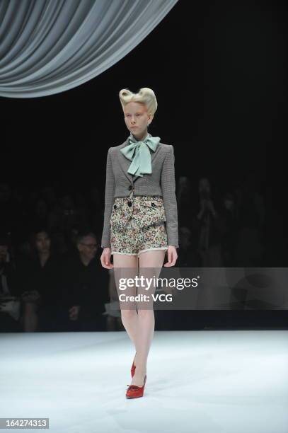 Model showcases designs on the runway at the Motonsri Ono show during Mercedes Benz Fashion Week Tokyo Autumn/Winter 2013/14 at Shibuya Hikarie...