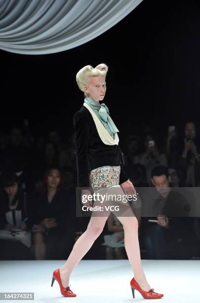 Model showcases designs on the runway at the Motonsri Ono show during Mercedes Benz Fashion Week Tokyo Autumn/Winter 2013/14 at Shibuya Hikarie...