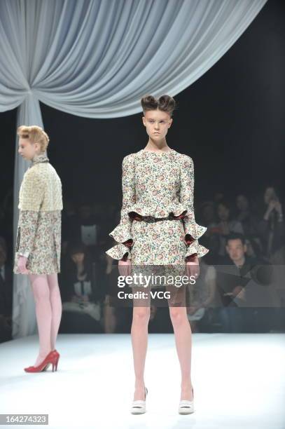 Models showcase designs on the runway at the Motonsri Ono show during Mercedes Benz Fashion Week Tokyo Autumn/Winter 2013/14 at Shibuya Hikarie...