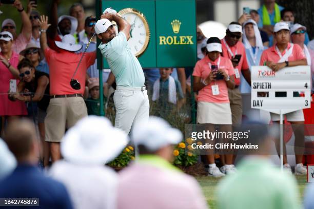 Jason Day of Australia plays his shot from the tenth tee during the final round of the TOUR Championship at East Lake Golf Club on August 27, 2023 in...