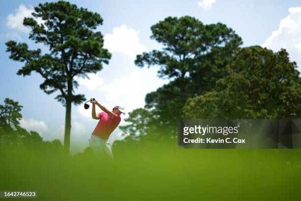 Matthew Fitzpatrick of England plays his shot from the fourth tee during the final round of the TOUR Championship at East Lake Golf Club on August...