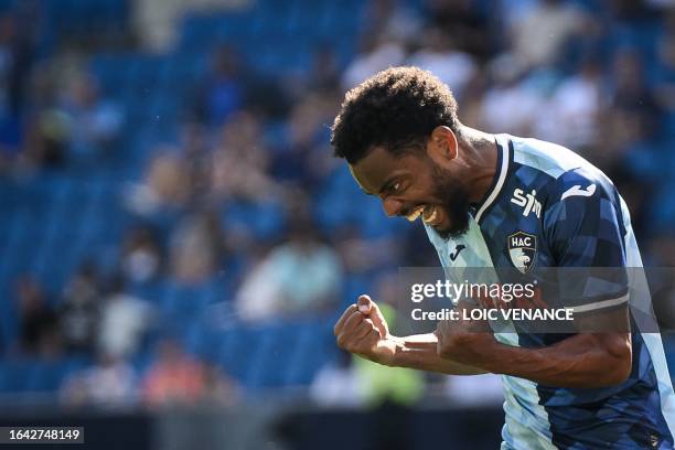 Le Havre's French-Congolese midfielder Nolan Mbemba celebrates after scoring his team's third goal during the French L1 football match between Le...