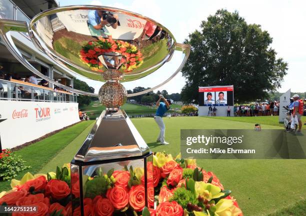 Adam Schenk of the United States plays his shot from the first tee during the final round of the TOUR Championship at East Lake Golf Club on August...