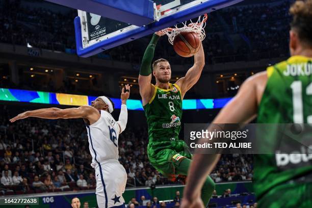 Lithuania's Tadas Sedekerskis dunks against the US during the FIBA Basketball World Cup second round match between US and Lithuania at the Mall of...