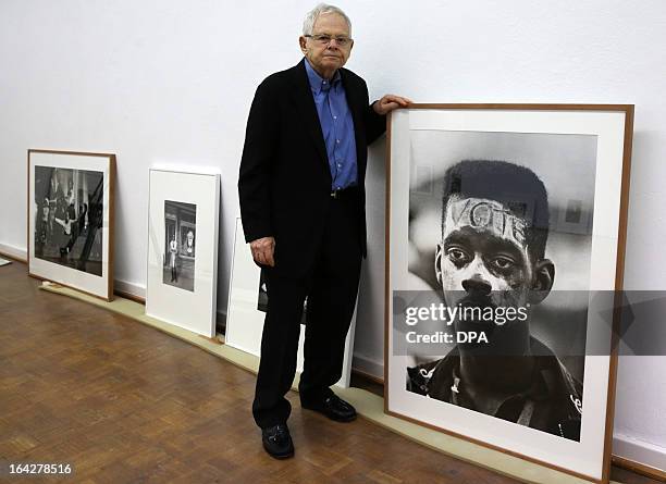 Photographer Steve Schapiro poses next to some of his works during a press conference on March 22, 2013 at the Kunsthalle museum in Rostock,...