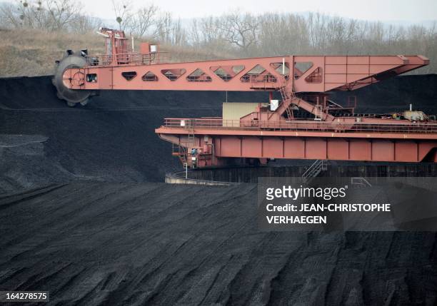 Picture taken on March 21, 2013 shows coal storage area at the EDF coal-fired plant in Blenod-les-Pont-a-Mousson,eastern France. The EDF plant...