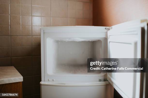 an empty open fridge freezer - frys bildbanksfoton och bilder