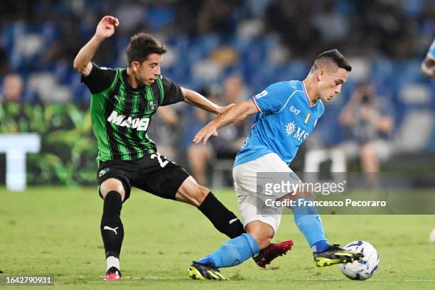 Giacomo Raspadori of SSC Napoli battles for possession with Maxime Lopez of US Sassuolo during the Serie A TIM match between SSC Napoli and US...