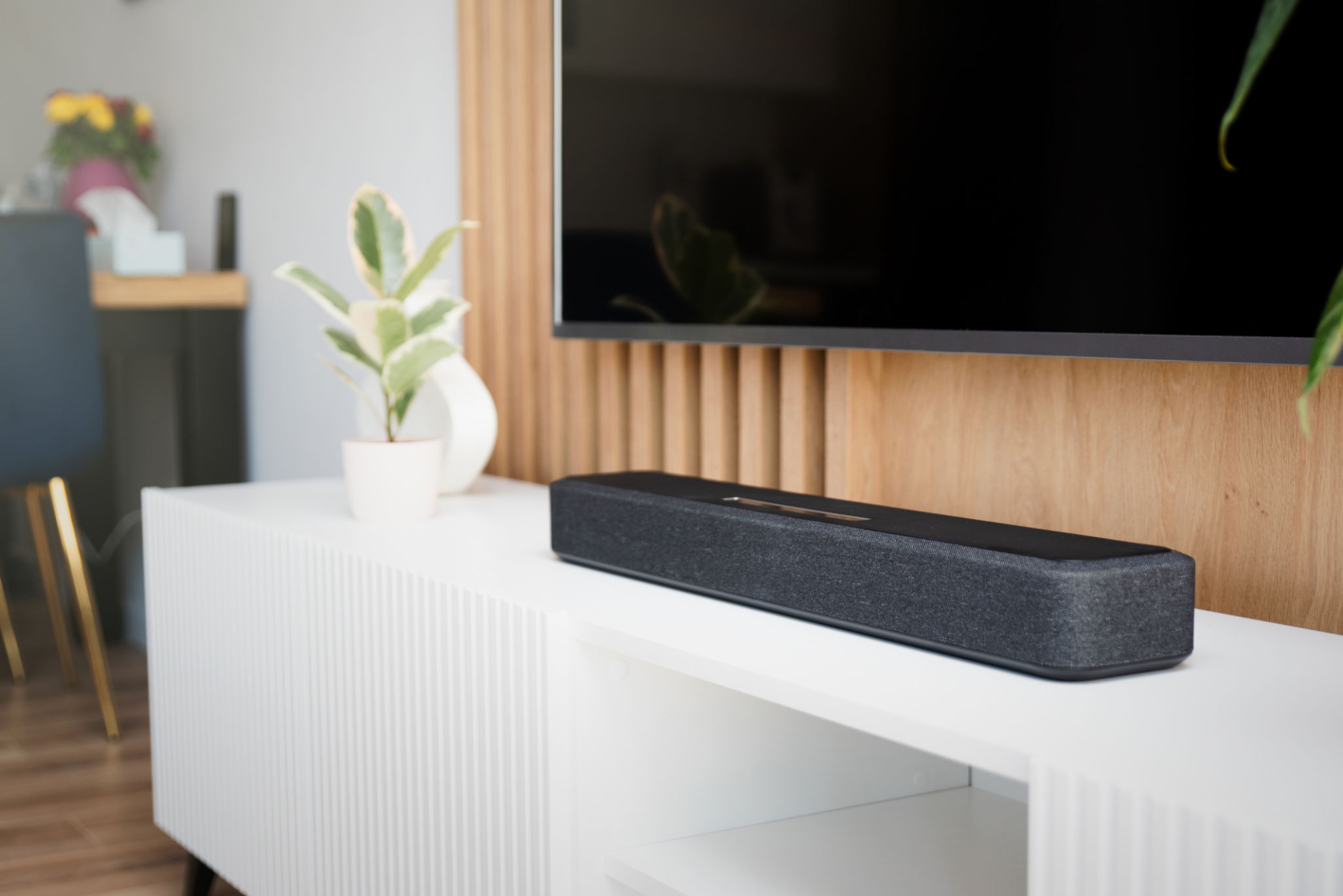 Soundbar in a modern home. Listening to music Soundbar in a modern home. Listening to music