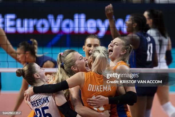 Dutch players celebrate during a volleyball game between Italy and The Netherlands, Sunday 03 September 2023 in Brussels, the bronze medal match of...