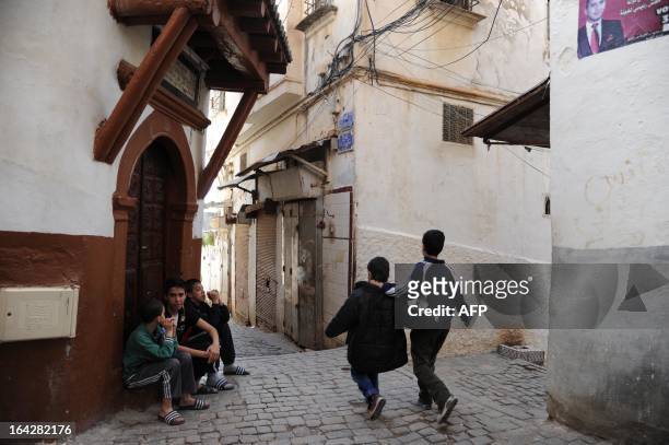 Children walk in a narrow street of the Kasbah of Algiers on March 22, 2013 in Algeria. The Kasbah is a Unesco World Heritage site. AFP PHOTO FAROUK...