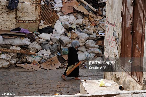 Childs walks past rubbishes in the Kasbah of Algiers on March 22, 2013 in Algeria. The Kasbah is a Unesco World Heritage site. AFP PHOTO FAROUK...