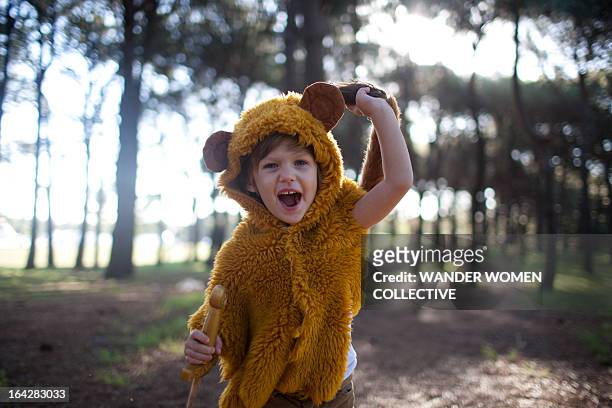 where the wild things are, boy  playing in forest - pet clothing stock pictures, royalty-free photos & images