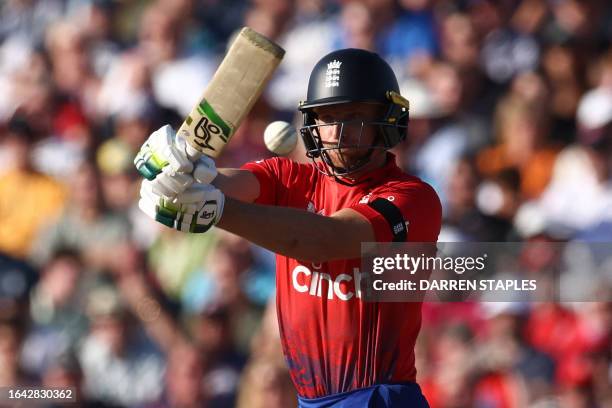 England's Jos Buttler plays a shot during the third T20 international cricket match between England and New Zealand at Edgbaston, in Birmingham,...