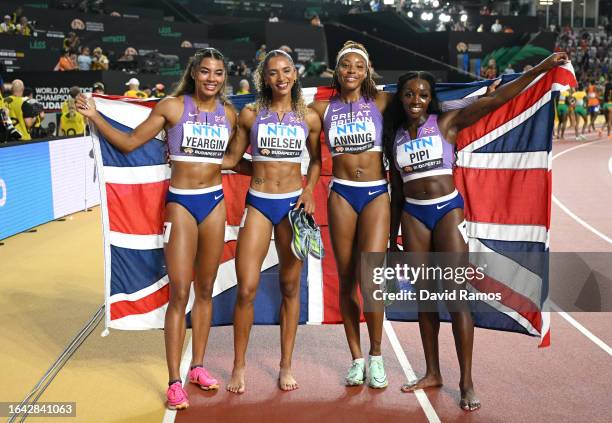 Bronze medalists Nicole Yeargin, Laviai Nielsen, Amber Anning, and Ama Pipi of Team Great Britain pose for a photo after the Women's 4x400m Relay...