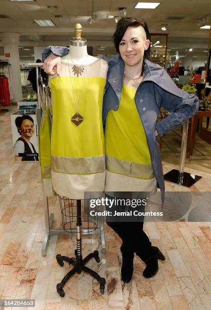 Designer Michelle Franklin poses with her Project Runway Lord & Taylor challenge winning design during an in-store visit to the Lord & Taylor...