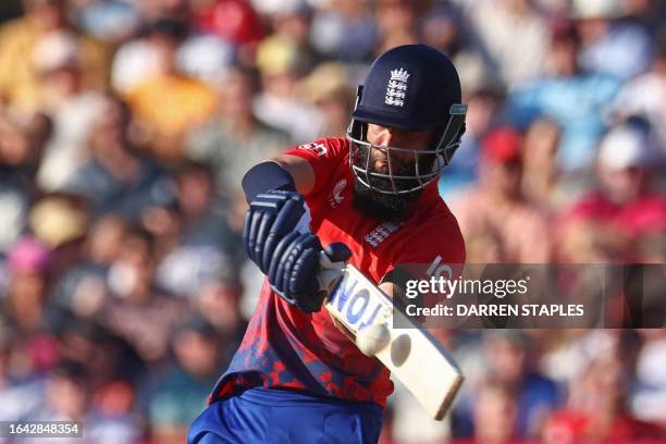 England's Moeen Ali hits a six during the third T20 international cricket match between England and New Zealand at Edgbaston, in Birmingham, central...