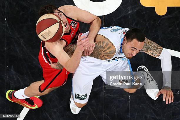 Jeremiah Trueman of the Wildcats and Corey Henry of the Breakers contest for a rebound during the round 24 NBL match between the Perth Wildcats and...