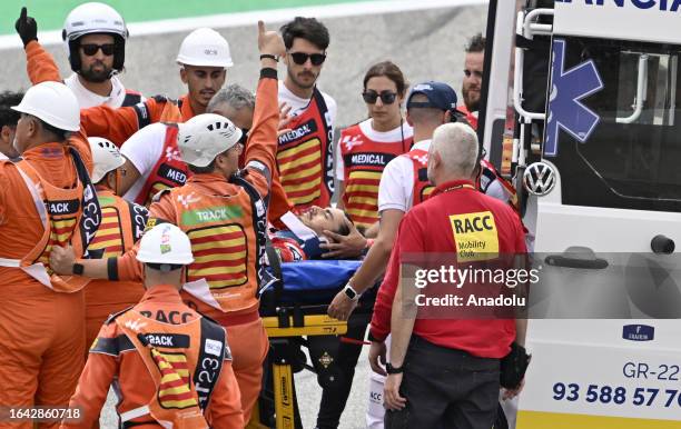 Francesco Bagnaia of Ducati Lenovo is taken into an ambulance on a stretcher by track marshals after a crash during the Catalunya Moto Grand Prix at...