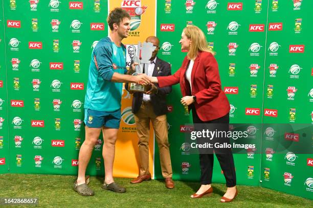 Mitchell Marsh of Australia with Pholetsi Moseki of Cricket South Africa and Andra Nel of KFC during the 3rd KFC T20 International match between...