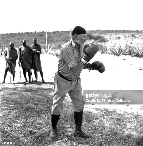Author Ernest Hemingway keeps fit by boxing while on a big game hunt in September 1952 in Kenya.