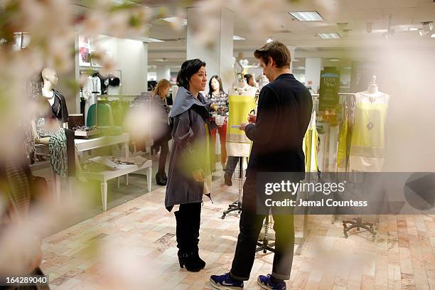 Members of the media speak with designer Michelle Franklin during an in-store visit to the Lord & Taylor Flagship store on March 22, 2013 in New York...