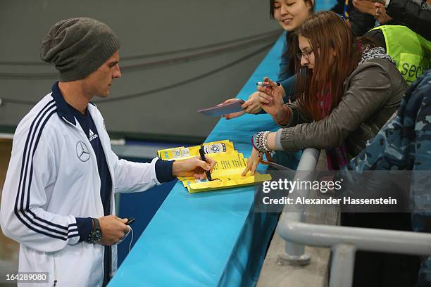 Mario Gomez of Germany signs autographs prior the FIFA 2014 World Cup qualifier group C match between Kazakhstan and Germany at Astana Arena on March...