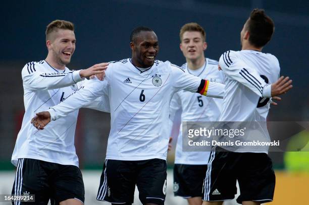 Moritz Leitner of Germany celebrates with teammates Reinhold Yabo and Andre Hoffmann after scoring his team's second goal during the International...
