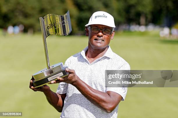 Vijay Singh of Fiji poses with the trophy after winning the The Ally Challenge presented by McLaren at Warwick Hills Golf And Country Club on August...