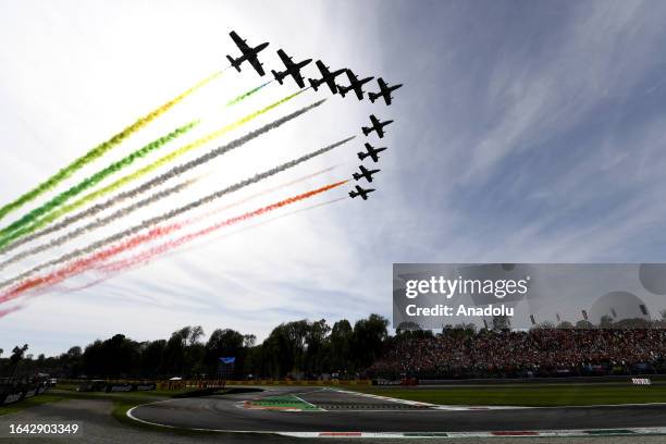 Aerobatic demonstration team of the Italian Air Force, 'Frecce Tricolori' performs over the circuit after F1 Grand Prix of Italy, at Autodromo...