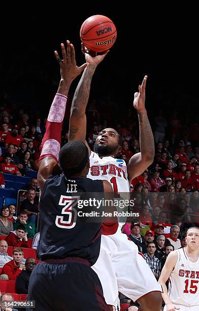 Cn1 shoots over Anthony Lee of the Temple Owls in the first half during the second round of the 2013 NCAA Men's Basketball Tournament at UD Arena on...