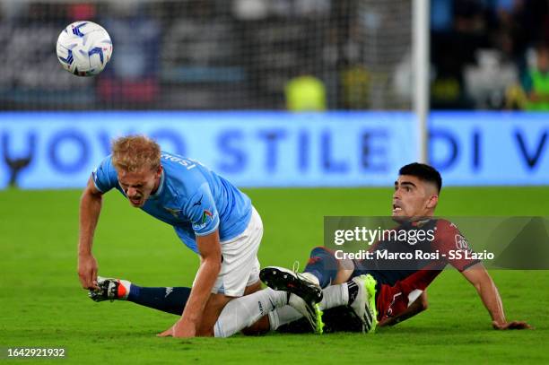Gustav Isaksen of SS Lazio compete for the ball with Johan Vasquez during the Serie A TIM match between SS Lazio and Genoa CFC at Stadio Olimpico on...