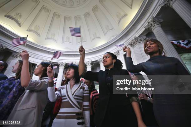 Immigrants celebrate after becoming American citizens at a naturalization ceremony at Federal Hall on March 22, 2013 in New York City. Seventy-four...