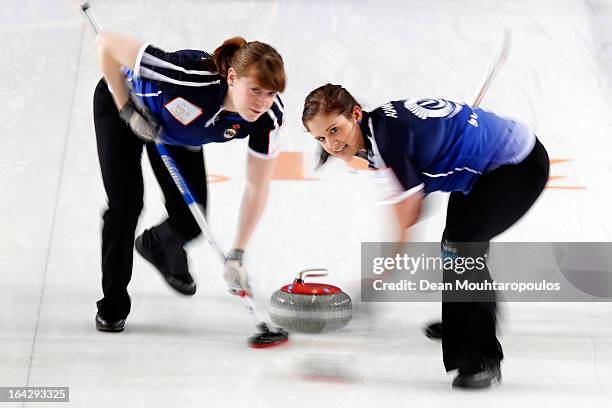 Vicki Adams and Claire Hamilton of Scotland sweep in the match between Scotland and Sweden on Day 7 of the Titlis Glacier Mountain World Women's...