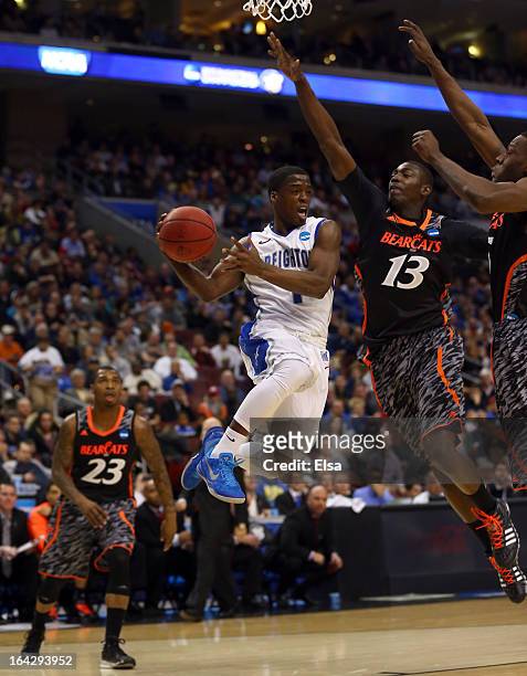 Austin Chatman of the Creighton Bluejays looks to pass the ball against Cheikh Mbodj of the Cincinnati Bearcats in the first half during the second...