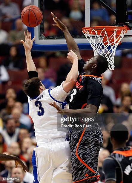 Doug McDermott of the Creighton Bluejays goes up for shoot against Cheikh Mbodj of the Cincinnati Bearcats in the first half during the second round...