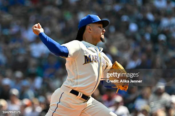 Teoscar Hernandez of the Seattle Mariners celebrates with teammates after hitting a solo home run during the first inning against the Kansas City...