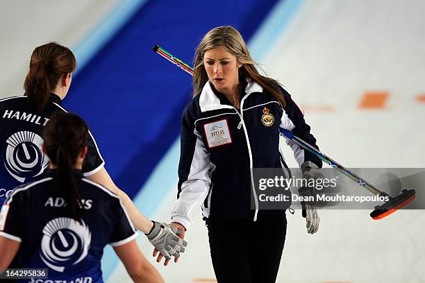 Eve Muirhead of Scotland congratulates team mates Vicki Adams and Claire Hamilton in the match between Scotland and Sweden on Day 7 of the Titlis...