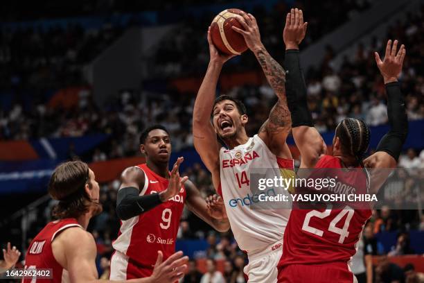 Spain's Willy Hernangomez shoots as Canada's Dillon Brooks tries to block him during the FIBA Basketball World Cup group L match between Spain and...