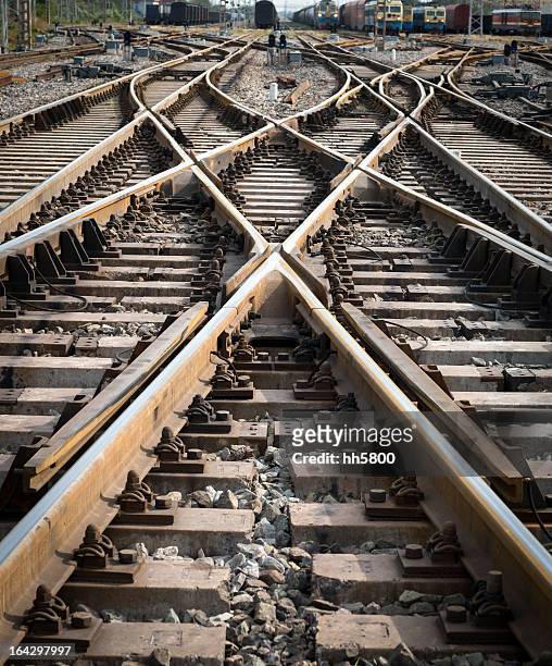 intersection point of multiple railroad tracks - crisscross stock pictures, royalty-free photos & images
