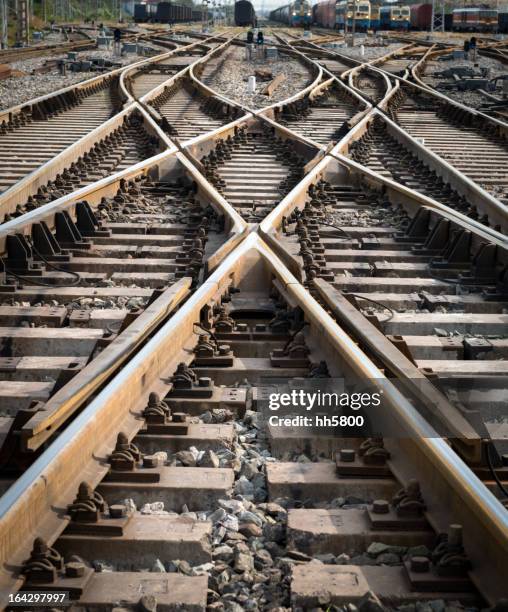 intersection point of multiple railroad tracks - crossroads sign stock pictures, royalty-free photos & images