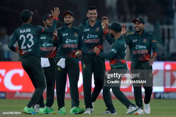 Bangladesh's players celebrate after winning the Asia Cup 2023 one-day international cricket match between Bangladesh and Afghanistan at the Gaddafi...