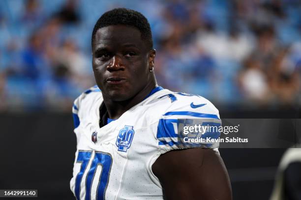 Germain Ifedi of the Detroit Lions stands on the sidelines during an NFL preseason football game against the Carolina Panthers at Bank of America...