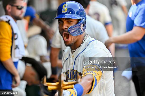 Julio Rodriguez of the Seattle Mariners celebrates with teammates after hitting a two-run home run during the fifth inning against the Kansas City...