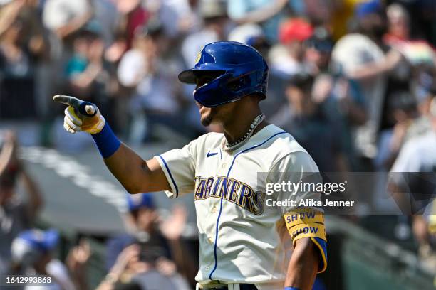 Julio Rodriguez of the Seattle Mariners gestures after hitting a two-run home run during the fifth inning against the Kansas City Royals at T-Mobile...